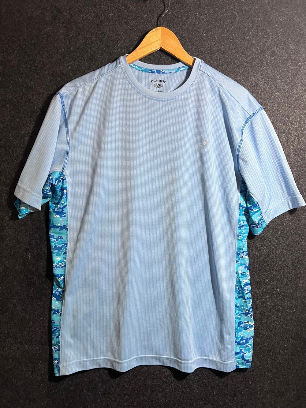 Reel Legends short sleeve Light Blue water shirt has small mark